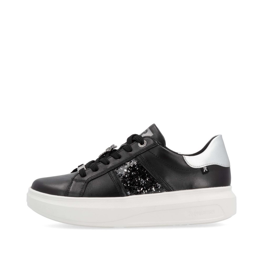 Black Rieker women´s low-top sneakers W1202-00 with an ultra light platform sole. Outside of the shoe.