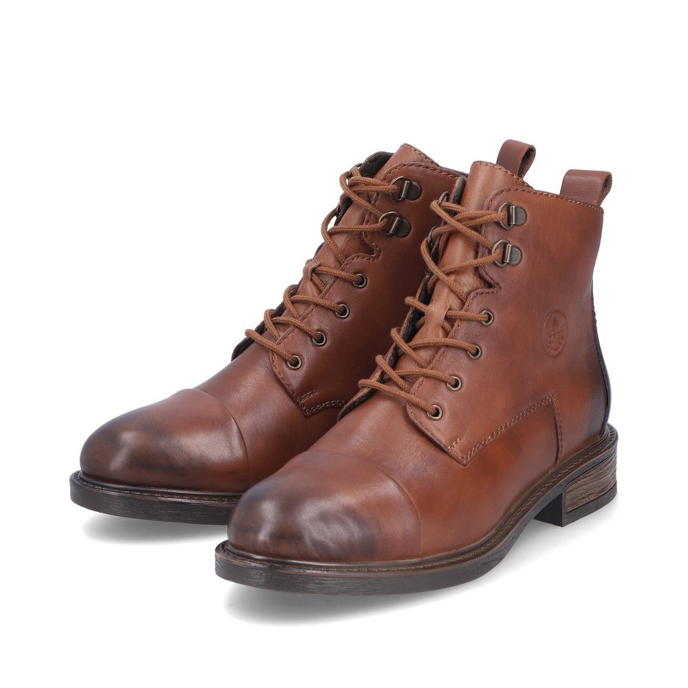 Bottes à lacets Rieker marron pour femme 71442-25 avec fermeture éclair. Chaussures inclinées sur le côté.