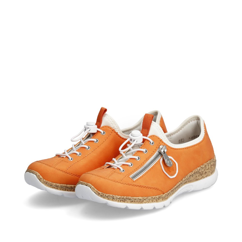 Light orange Rieker women´s slippers N4263-38 with an elastic lacing. Shoes laterally.
