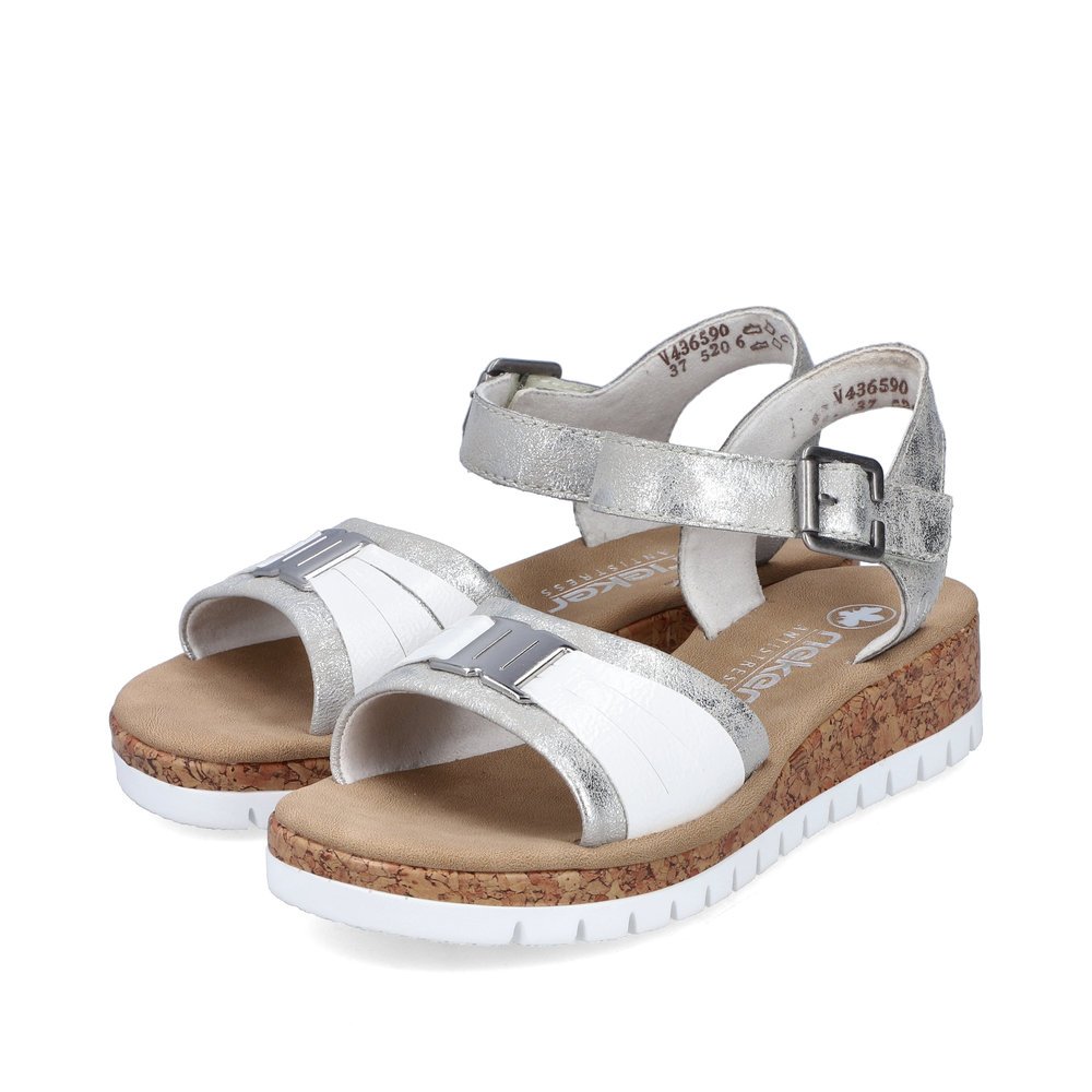 Silver Rieker women´s wedge sandals V4365-90 with a hook and loop fastener. Shoes laterally.