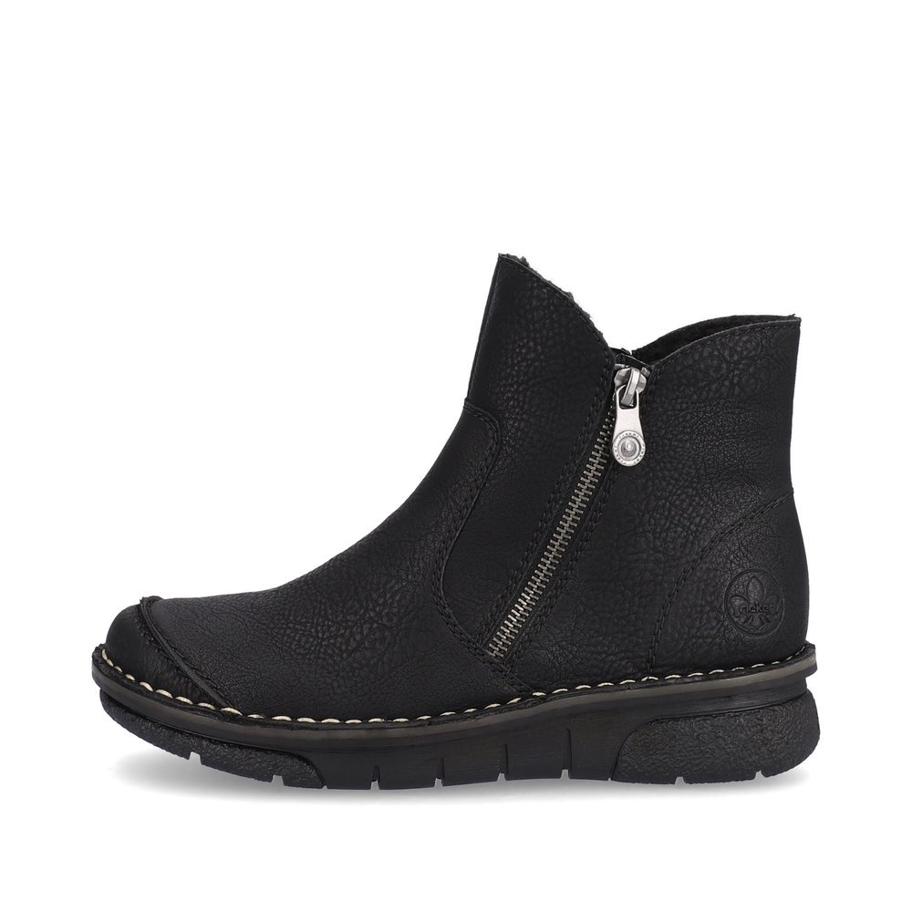 Black Rieker women´s ankle boots 73357-00 with a zipper as well as removable insole. Outside of the shoe.