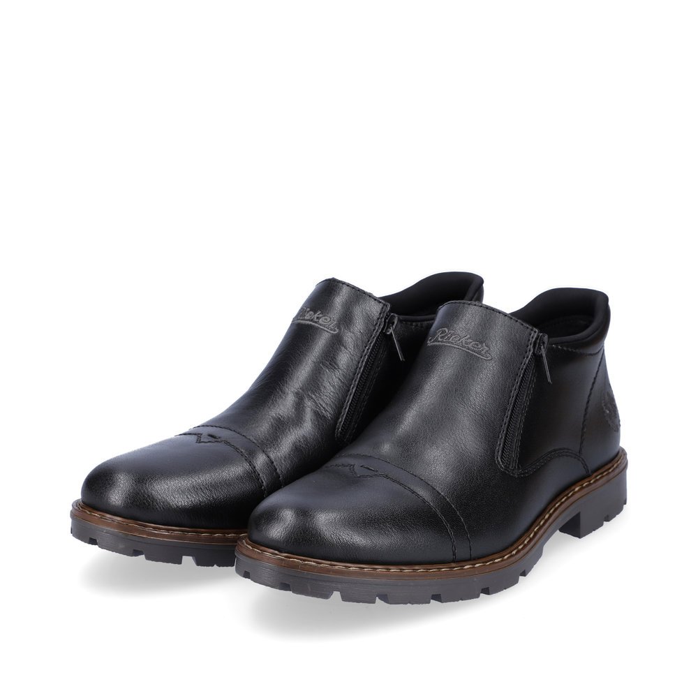 Black Rieker men´s ankle boots 12194-00 with zipper as well as comfort width G 1/2. Shoes laterally.