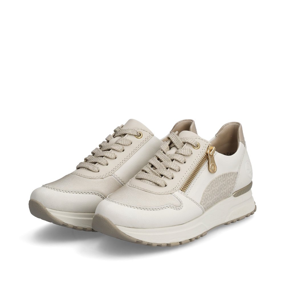 Off-white Rieker women´s low-top sneakers N7401-80 with a zipper. Shoes laterally.