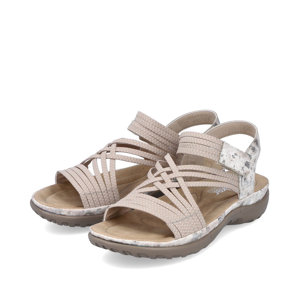 Beige Rieker women´s strap sandals 64888-60 with a hook and loop fastener. Shoes laterally.