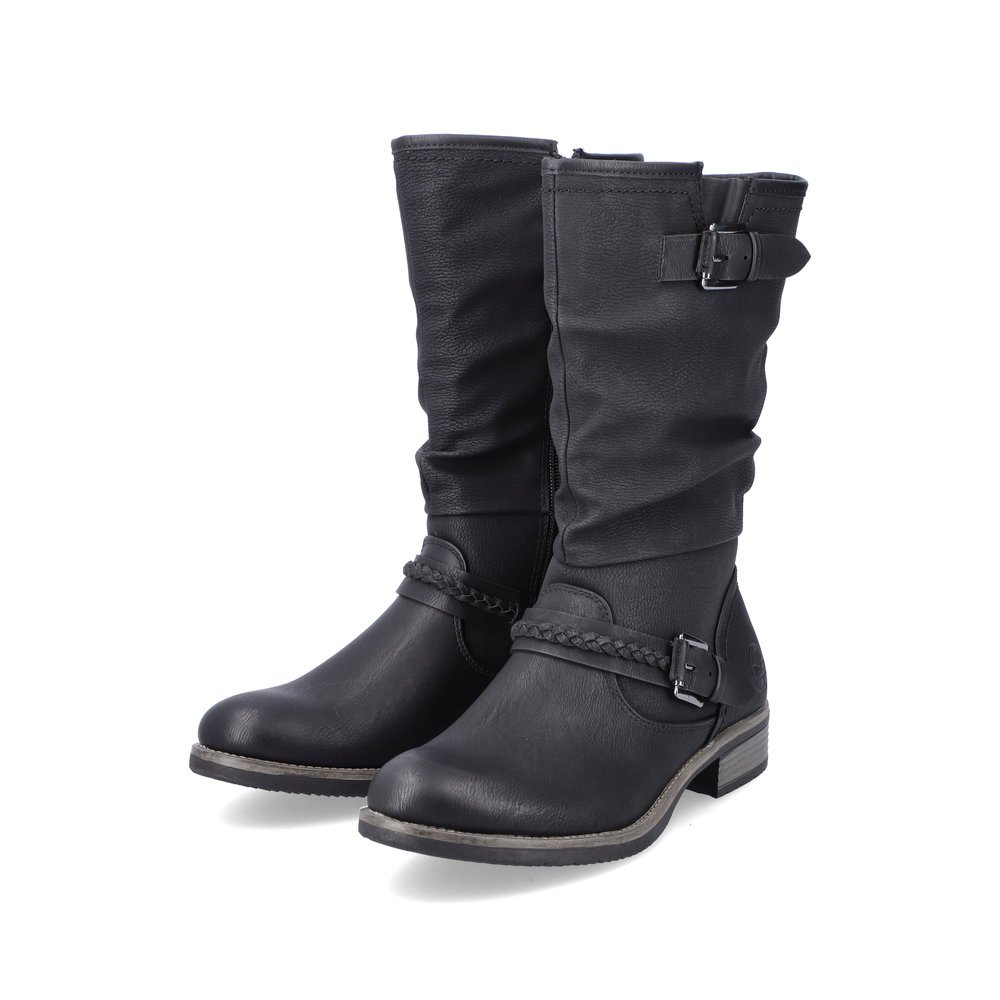 Black Rieker women´s ankle boots 98860-00 with decorative buckles as well as zipper. Shoes laterally.