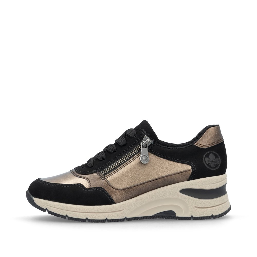 Beige Rieker women´s low-top sneakers N9301-91 with bronze finish as well as zipper. Outside of the shoe.