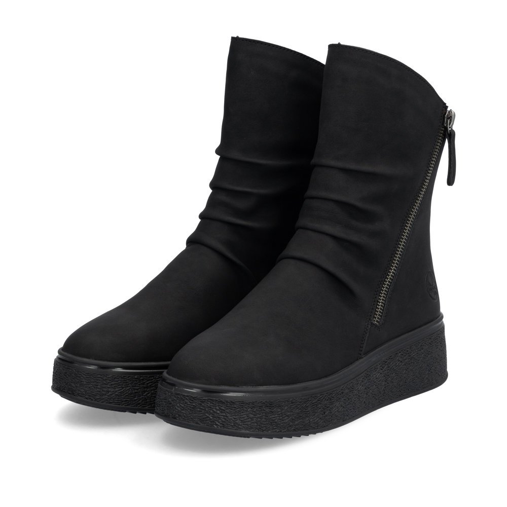 Black Rieker women´s ankle boots 78852-00 with zipper as well as a removable insole. Shoes laterally.