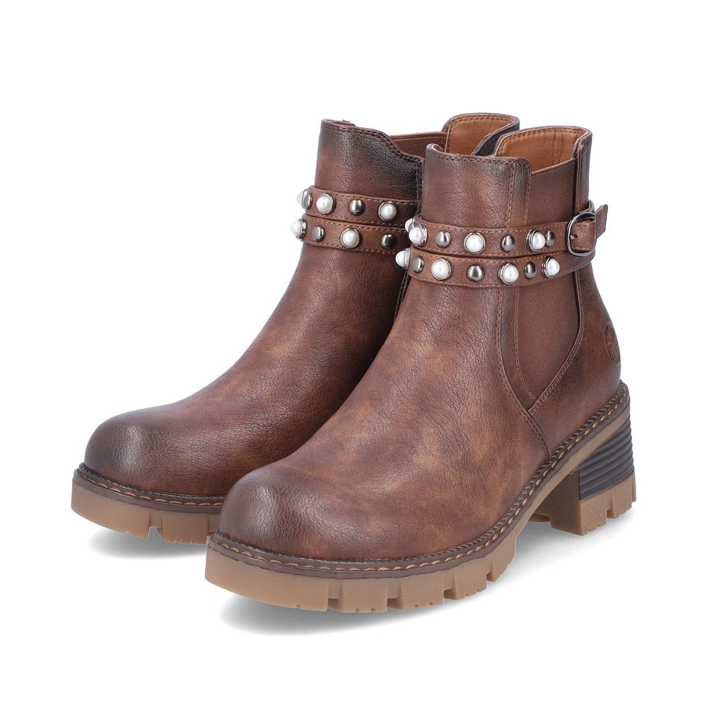 Bottes Chelseas Rieker marron pour femme 92064-25. Chaussures inclinées sur le côté.