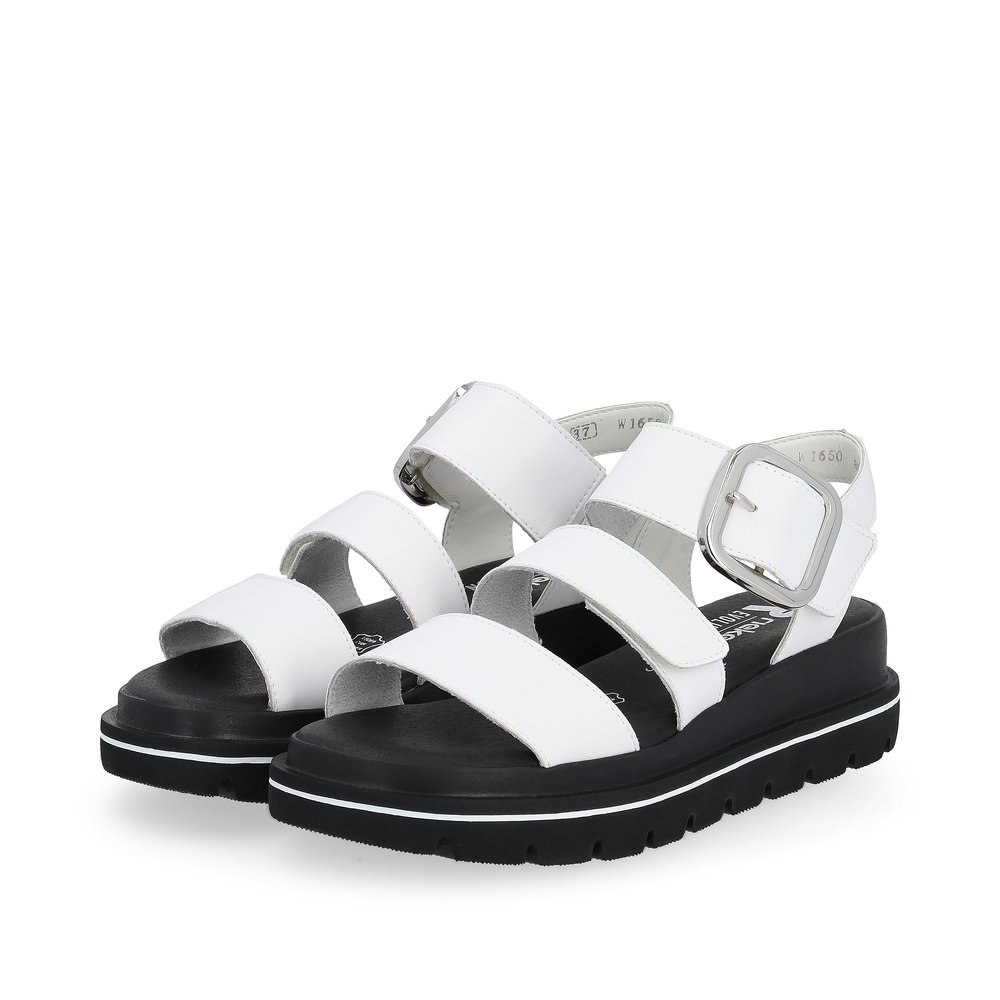 White Rieker women´s strap sandals W1650-80 with a flexible sole with wedge heel. Shoes laterally.