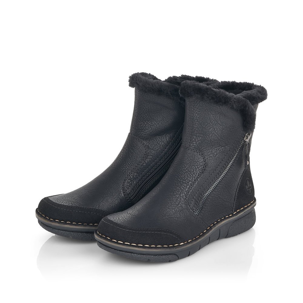 Black Rieker women´s ankle boots 73371-00 with furry shaft edge as well as a zipper. Shoes laterally.