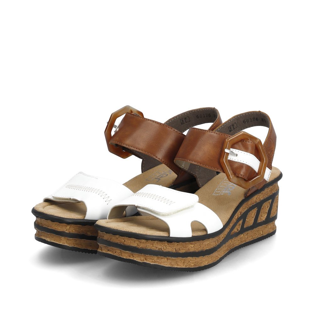 Snow white Rieker women´s wedge sandals 68176-80 with a hook and loop fastener. Shoes laterally.