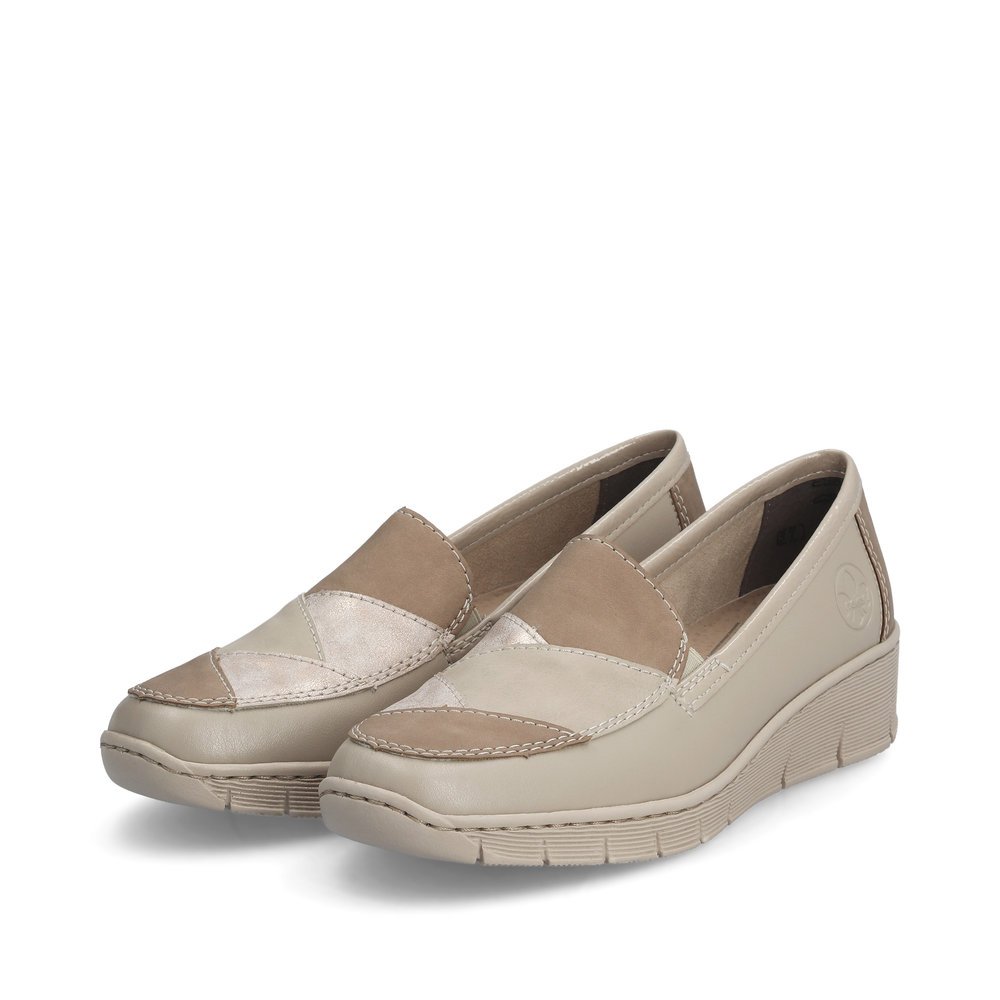 Beige Rieker women´s slippers 53785-60 with elastic insert as well as slim fit E. Shoes laterally.