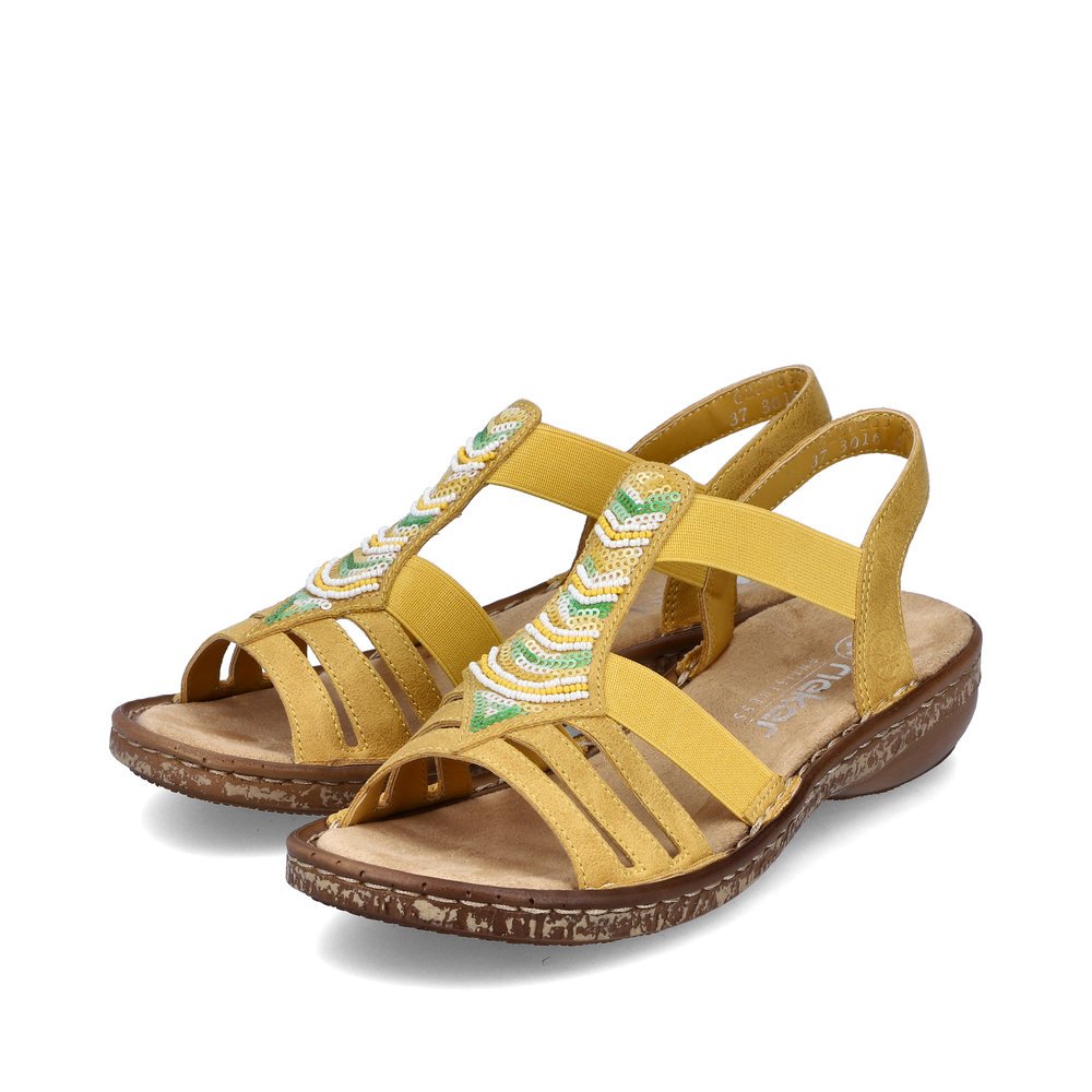 Rieker sandales à lanières jaunes femmes 62808-68 avec insert élastique. Chaussures inclinée sur le côté.