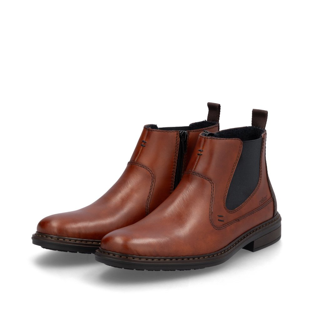 Brown Rieker men´s Chelsea boots 17654-22 with a zipper as well as extra width H. Shoes laterally.