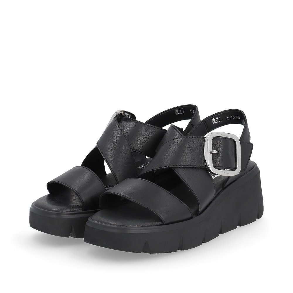 Black Rieker women´s wedge sandals W1550-00 with a flexible sole with wedge heel. Shoes laterally.