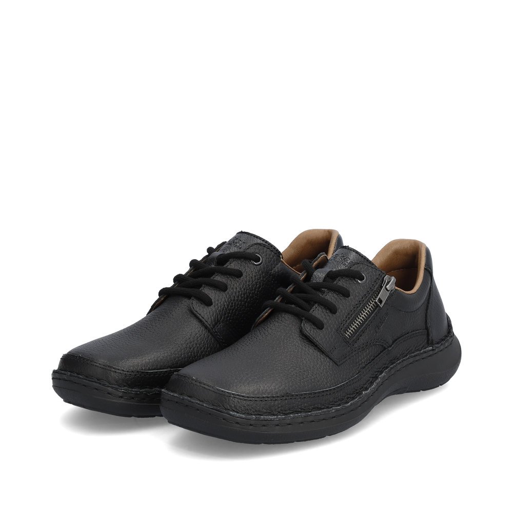 Rieker chaussures à lacets noires hommes 03002-00 avec fermeture éclair. Chaussures inclinée sur le côté.