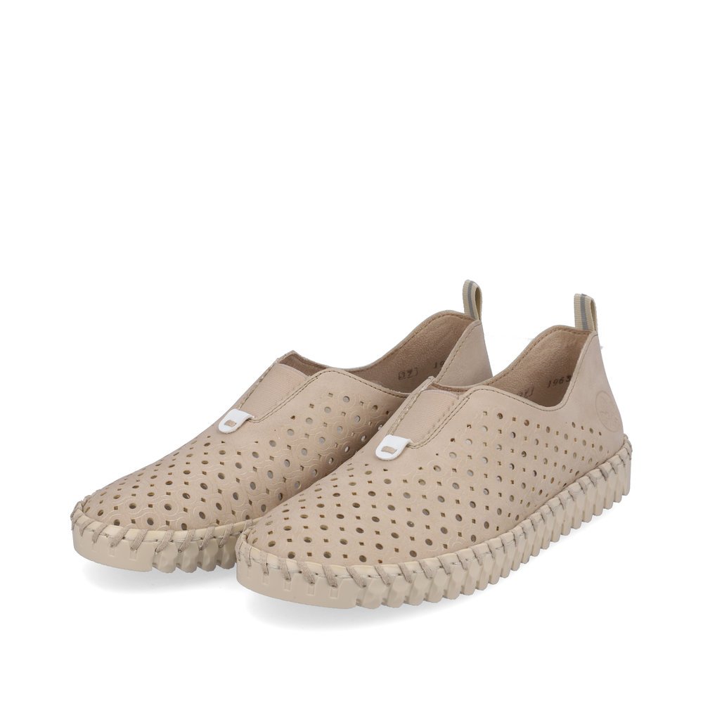 Light beige Rieker women´s slippers N1963-62 with an elastic insert. Shoes laterally.
