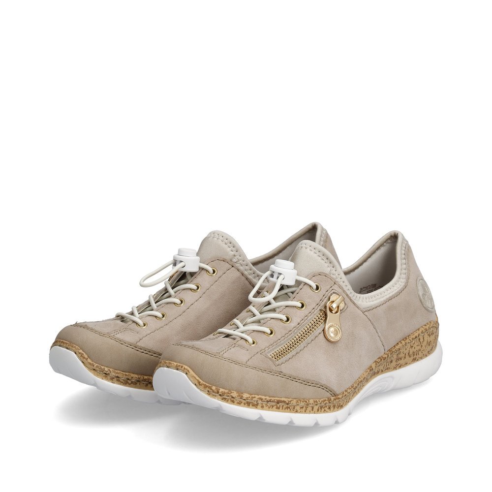 Cream beige Rieker women´s slippers N42F1-60 with an elastic lacing. Shoes laterally.