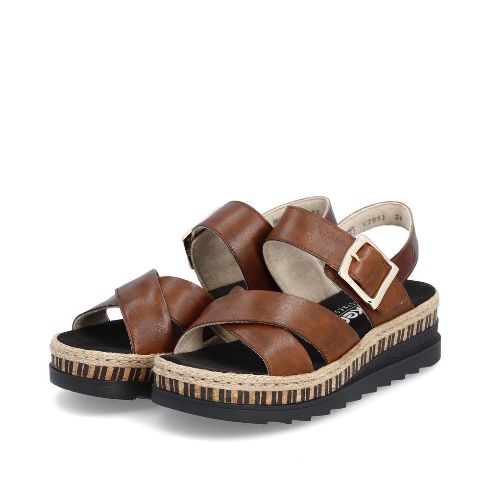 Rieker sandales compensées marron femmes V7951-24 avec fermeture velcro. Chaussures inclinée sur le côté.