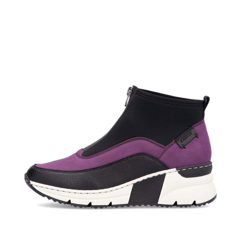 Black Rieker women´s high-top sneakers N6352-30 with a light sole with wedge heel. Outside of the shoe.