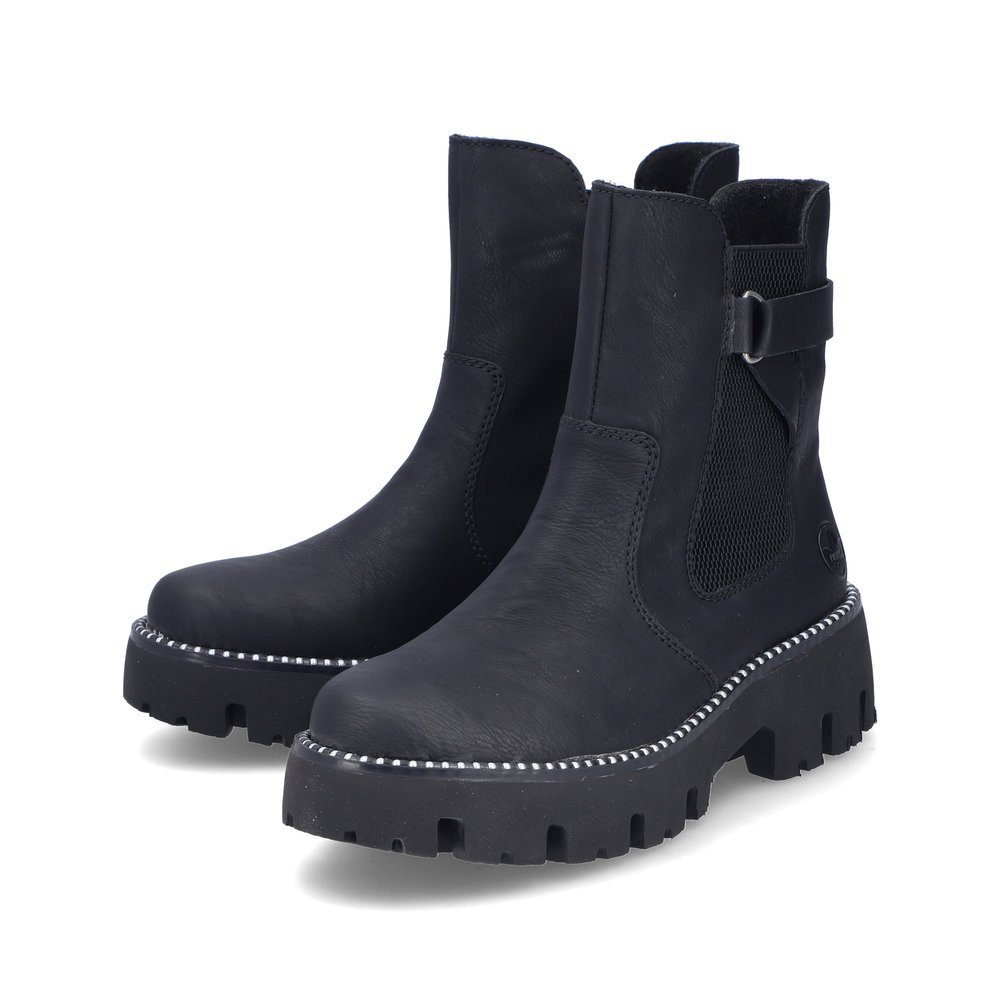 Bottes Chelseas Rieker noires pour femme Y3380-00 avec fermeture éclair. Chaussures inclinées sur le côté.