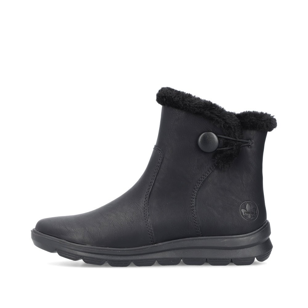 Black Rieker women´s ankle boots Z0080-00 with a furry shaft edge as well as zipper. Outside of the shoe.