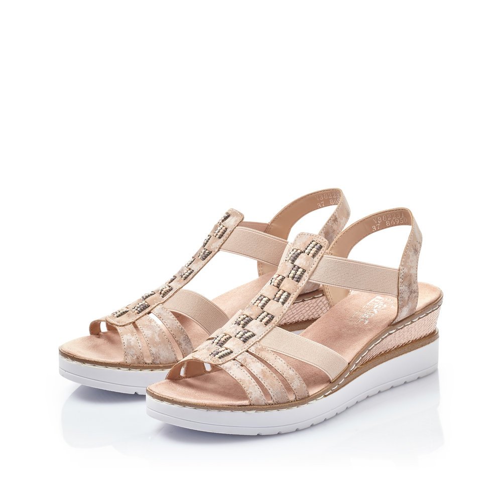 Dusky pink Rieker women´s wedge sandals V3822-31 with an elastic insert. Shoes laterally.
