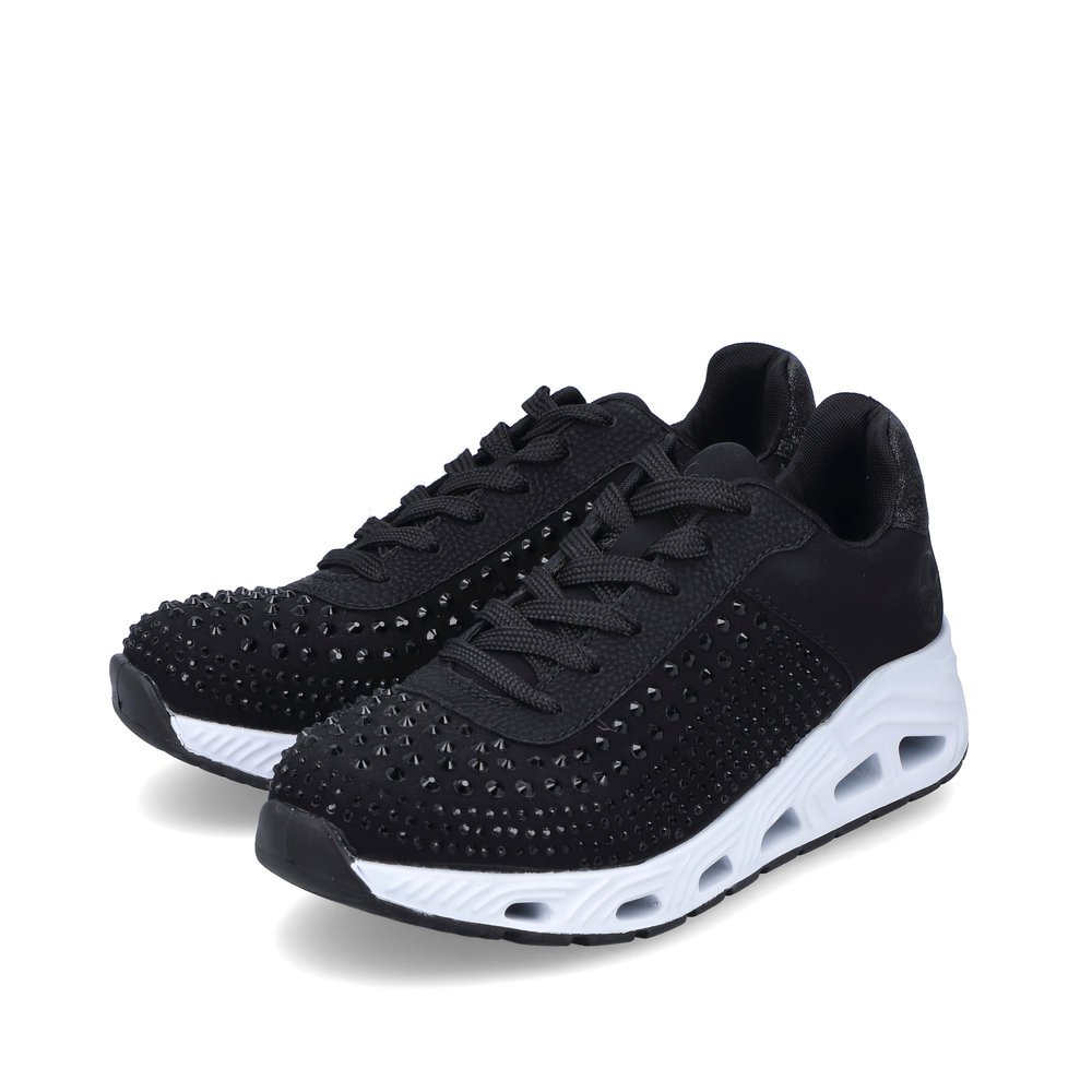Black Rieker women´s low-top sneakers N5201-00 with a flexible sole. Shoes laterally.