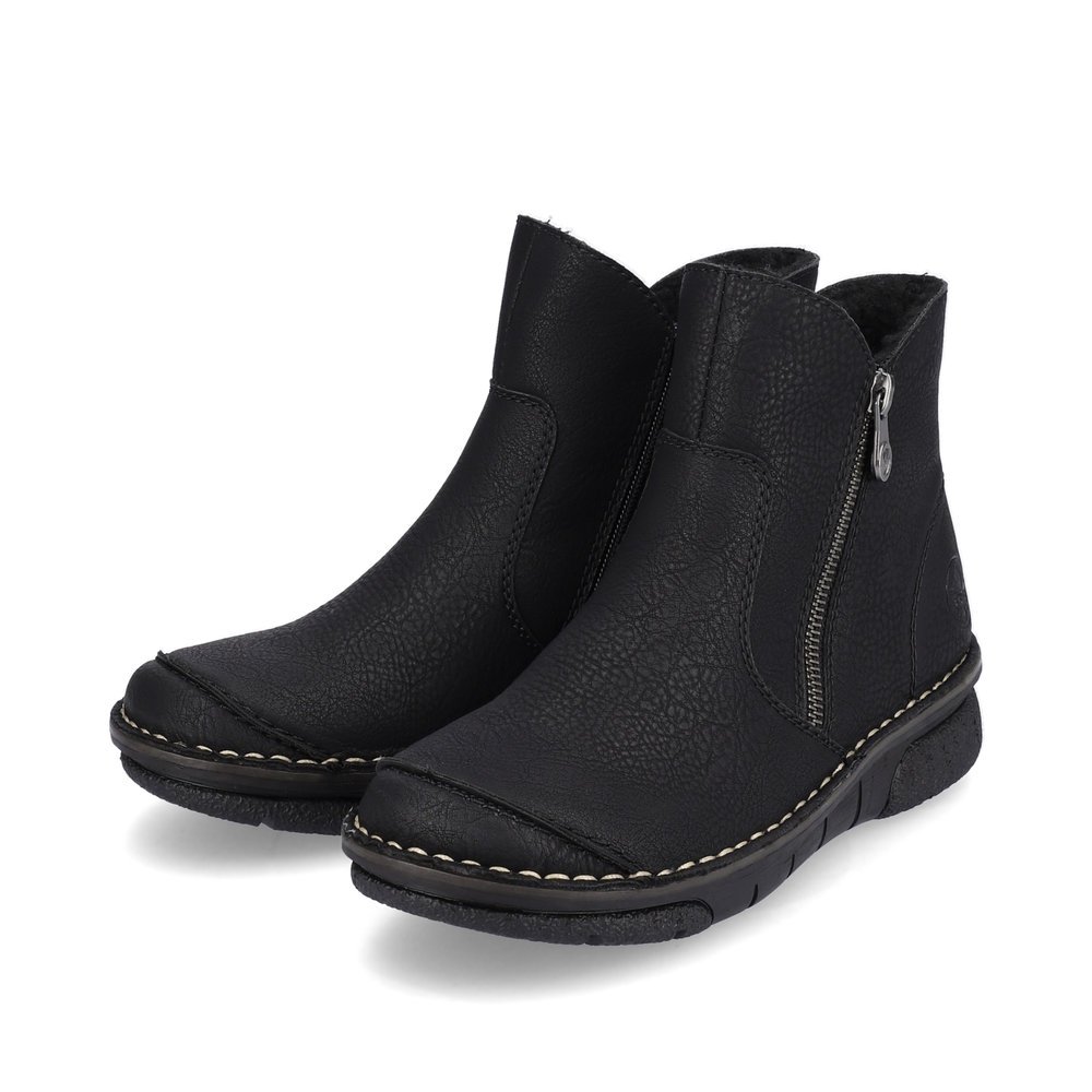 Black Rieker women´s ankle boots 73357-00 with a zipper as well as removable insole. Shoes laterally.