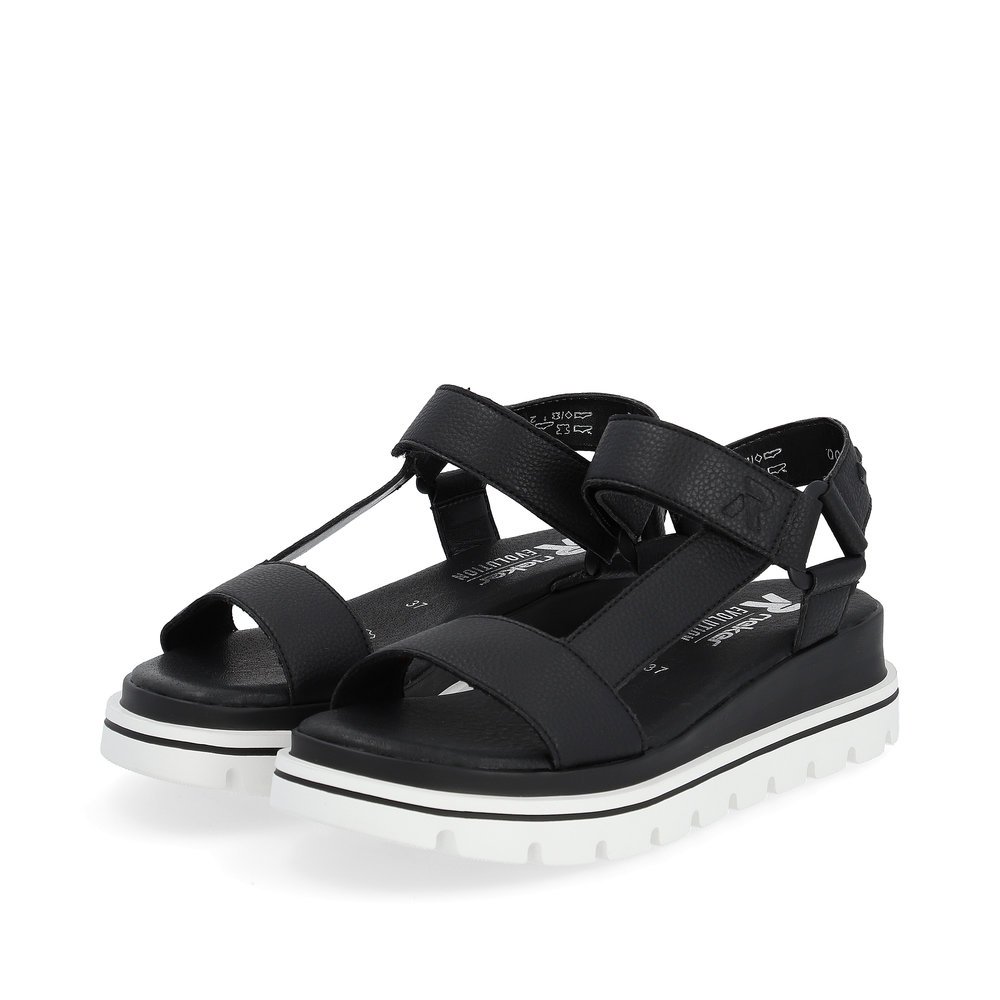 Black Rieker women´s strap sandals W1651-00 with a flexible sole with wedge heel. Shoes laterally.