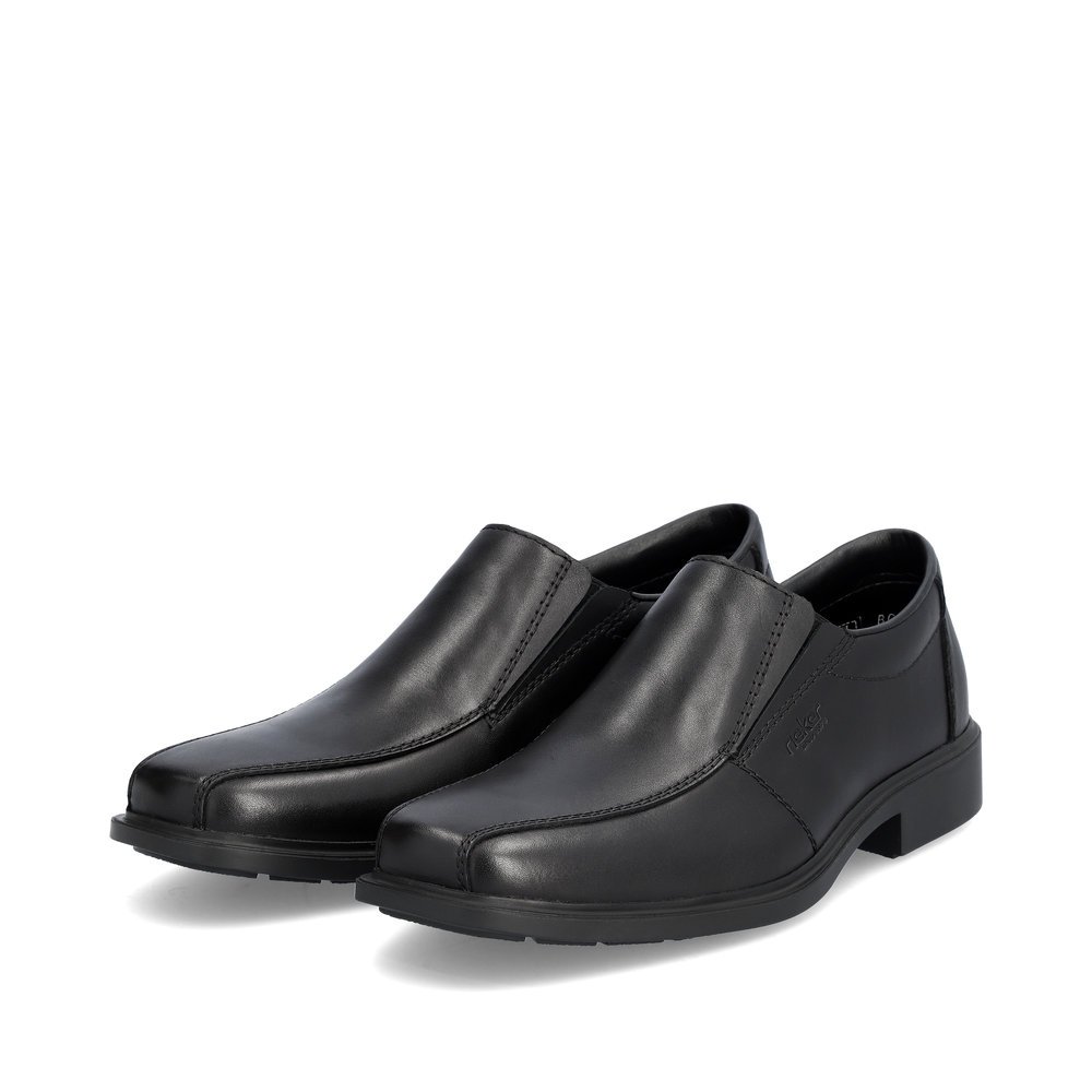 Black Rieker men´s slippers B0051-00 with elastic insert as well as extra width H. Shoes laterally.