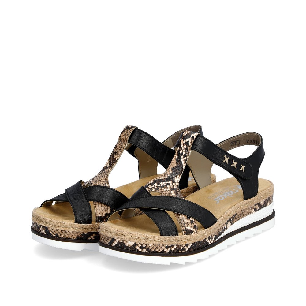 Black Rieker women´s wedge sandals V7919-00 with a hook and loop fastener. Shoes laterally.