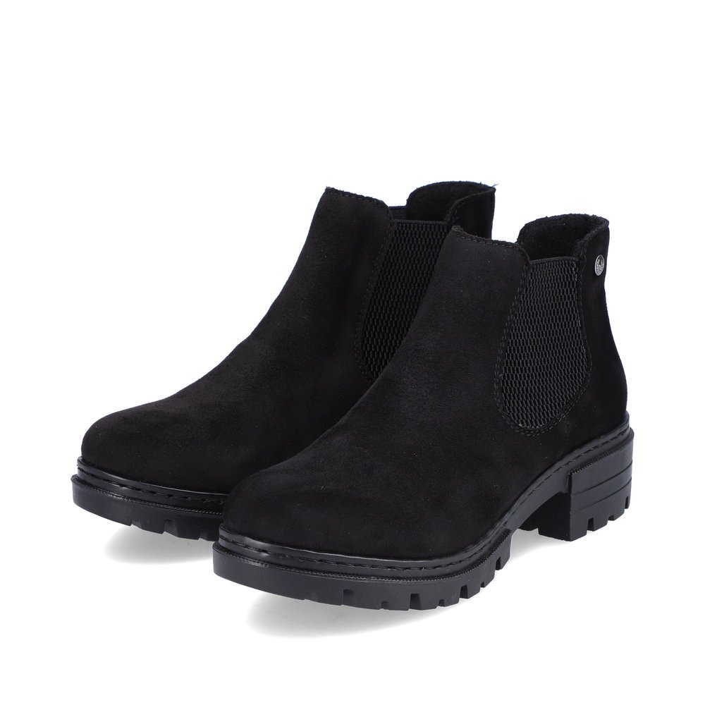 Bottines Rieker noires pour femme 76884-00 avec insert élastique. Chaussures inclinées sur le côté.