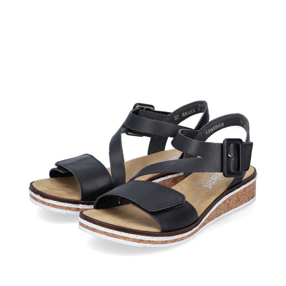 Black Rieker women´s wedge sandals V3660-02 with a hook and loop fastener. Shoes laterally.