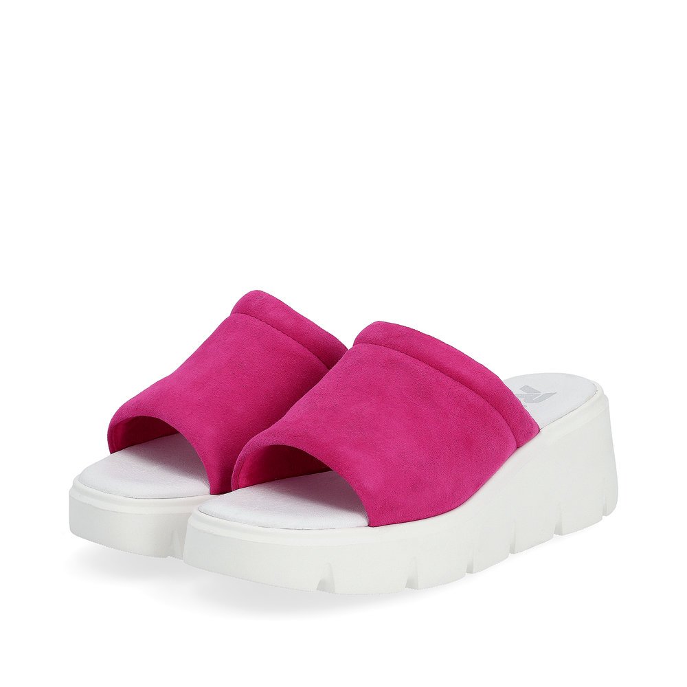 Pink Rieker women´s mules W1551-31 with an ultra light sole with wedge heel. Shoes laterally.
