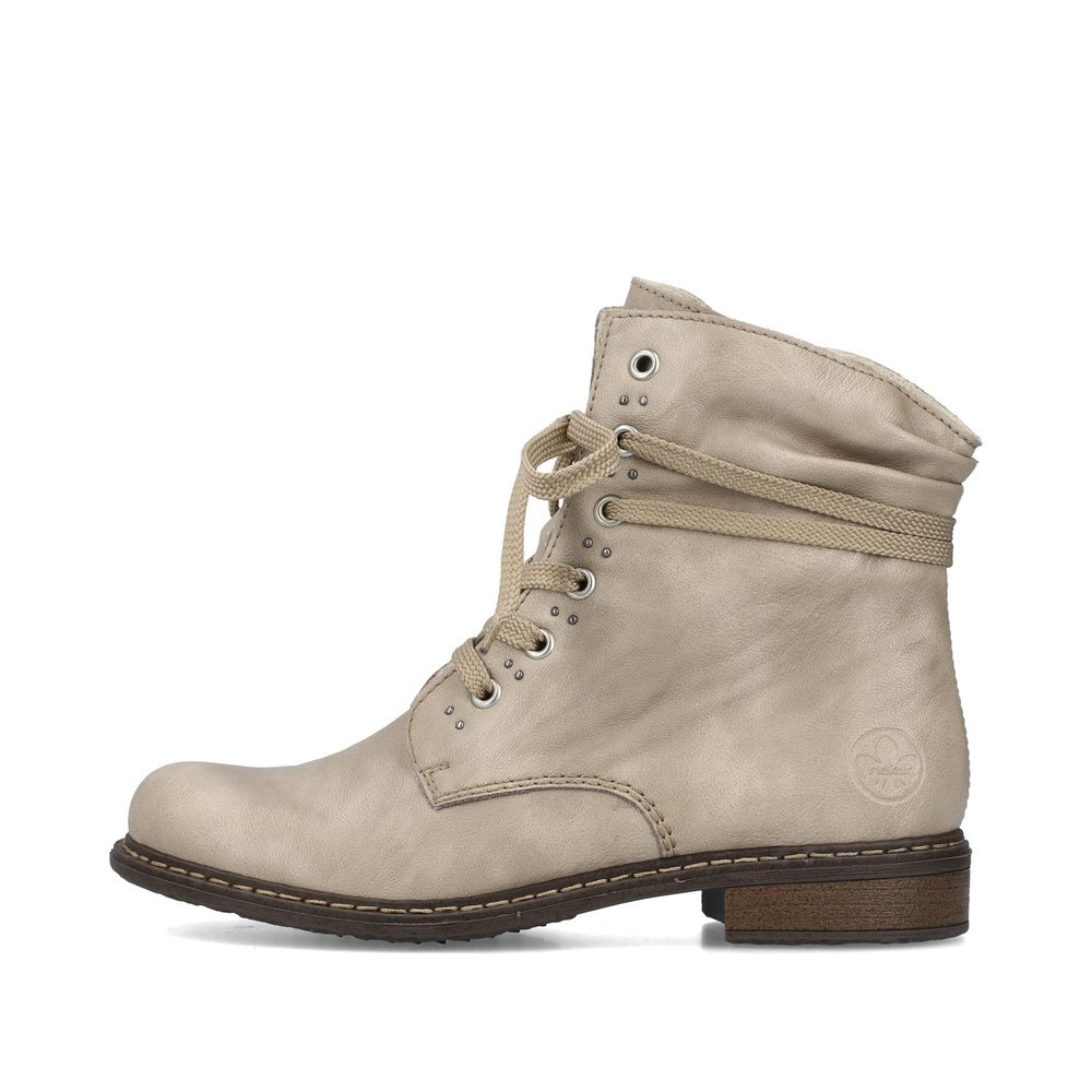 Bottes à lacets Rieker beiges pour femme 71218-62 avec fermeture éclair. Côté extérieur de la chaussure.