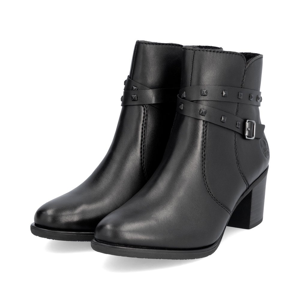 Black Rieker women´s ankle boots Y2059-00 with decorative buckle as well as zipper. Shoes laterally.