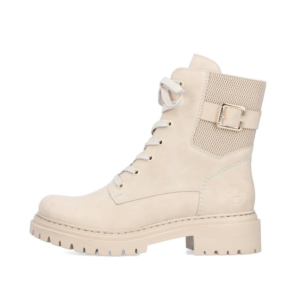 Beige Rieker women´s biker boots 72631-63 with decorative buckle as well as zipper. Outside of the shoe.