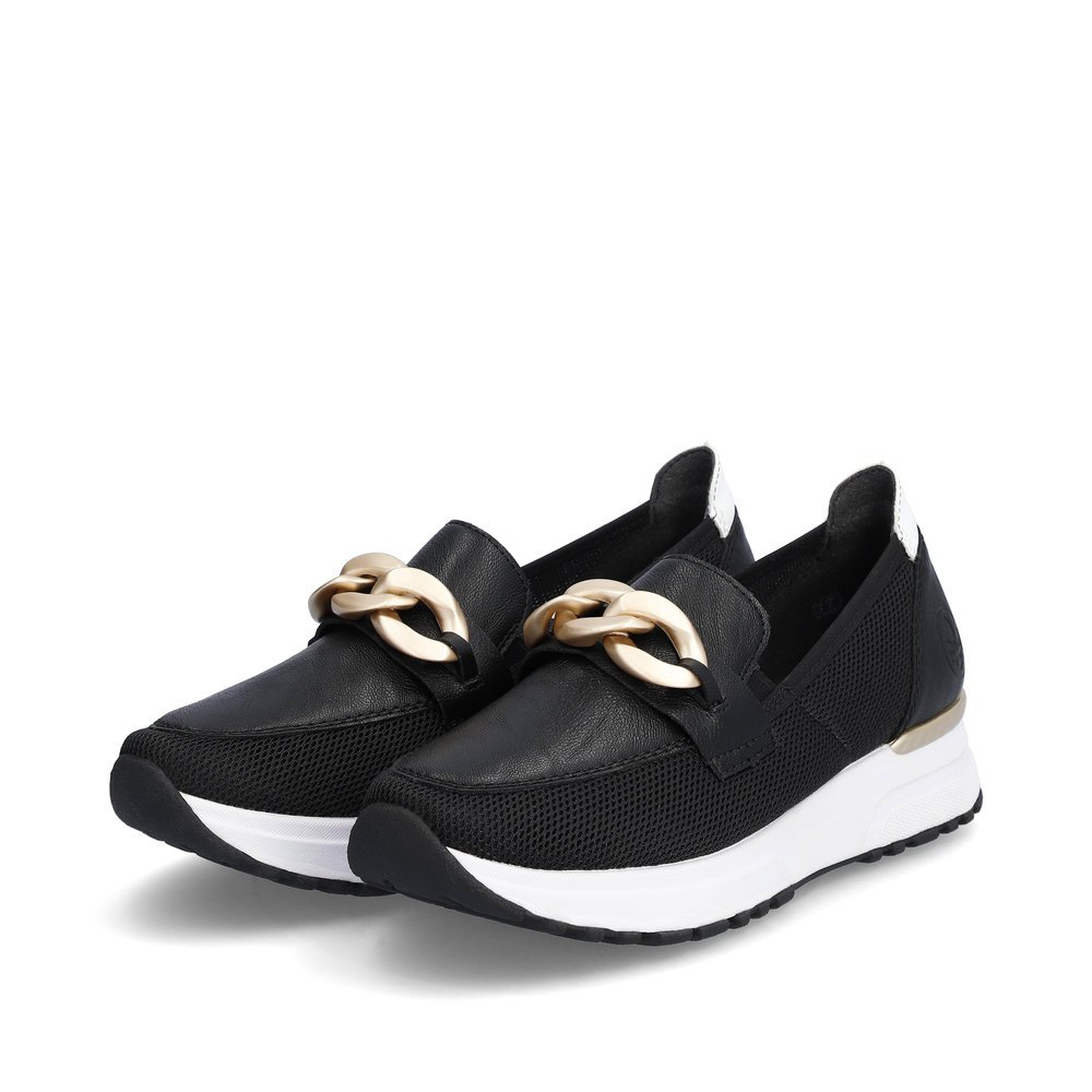 Black Rieker women´s slippers N7458-00 with elastic insert as well as stylish chain. Shoes laterally.