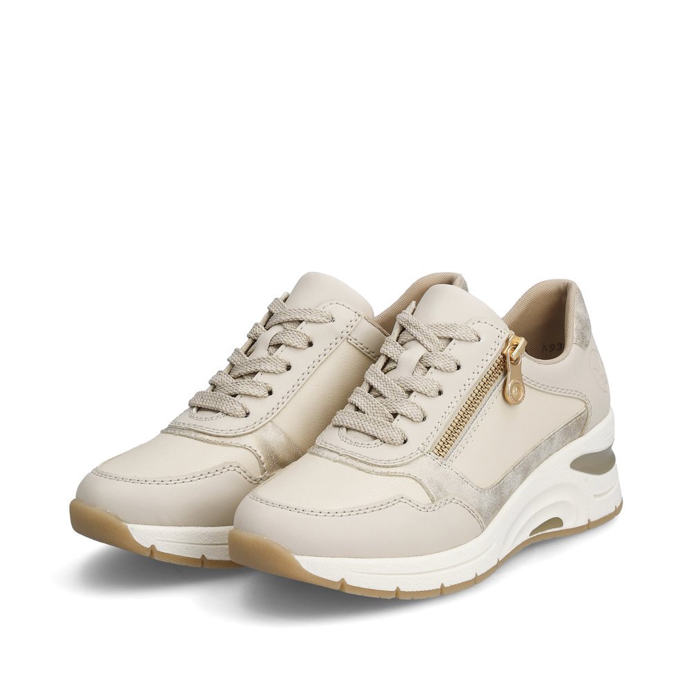 Rieker baskets basses beiges femmes N9301-60 avec une fermeture éclair. Chaussures inclinée sur le côté.