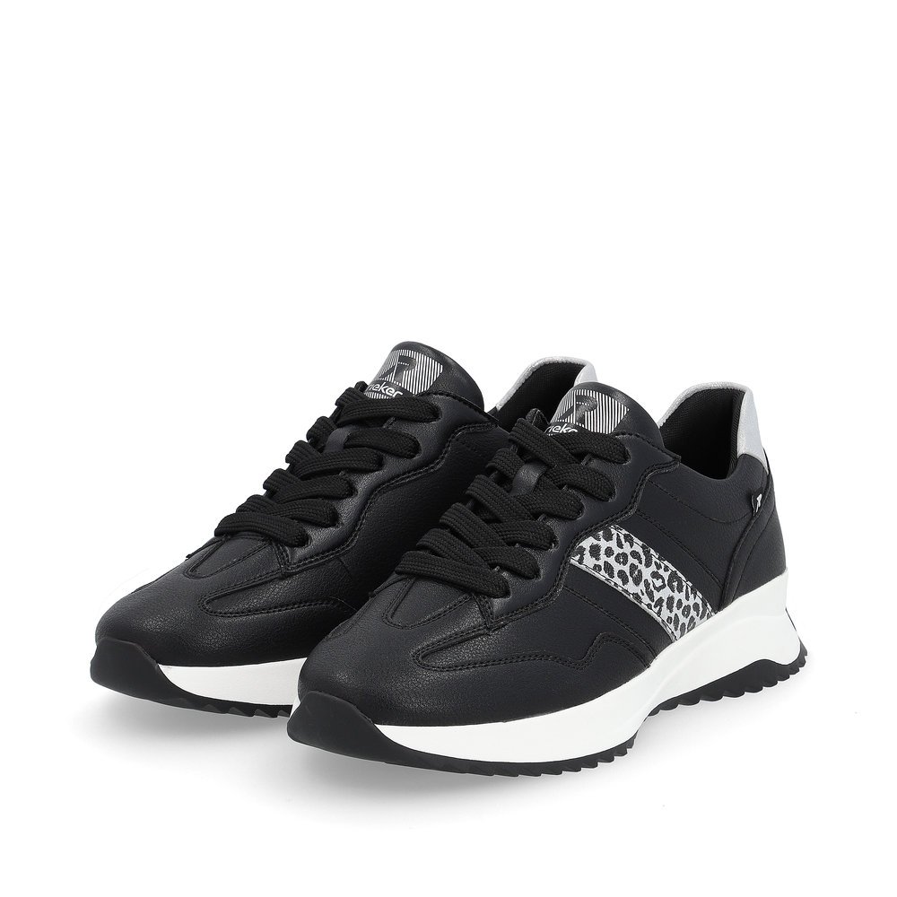 Black Rieker women´s low-top sneakers W1301-00 with an abrasion-resistant sole. Shoes laterally.