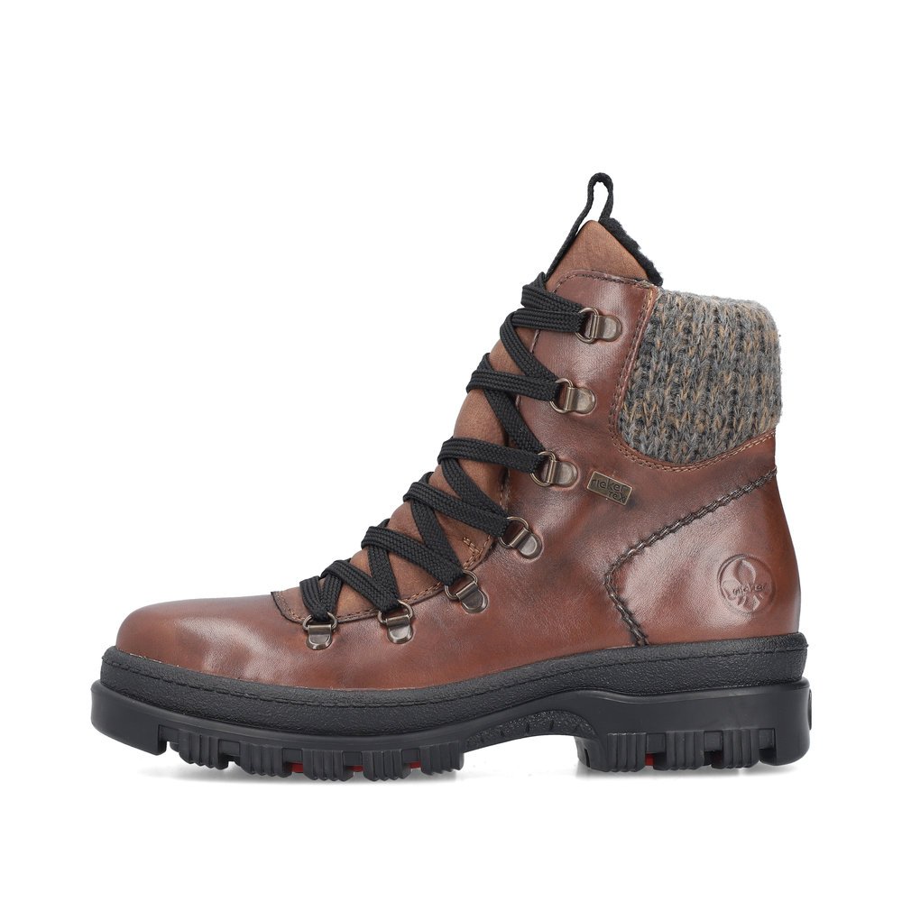 Maroon Rieker women´s lace-up boots X8200-25 with a Flip-Grip sole with spikes. Outside of the shoe.