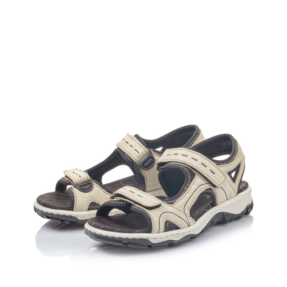 Beige Rieker women´s hiking sandals 68866-60 with a hook and loop fastener. Shoes laterally.