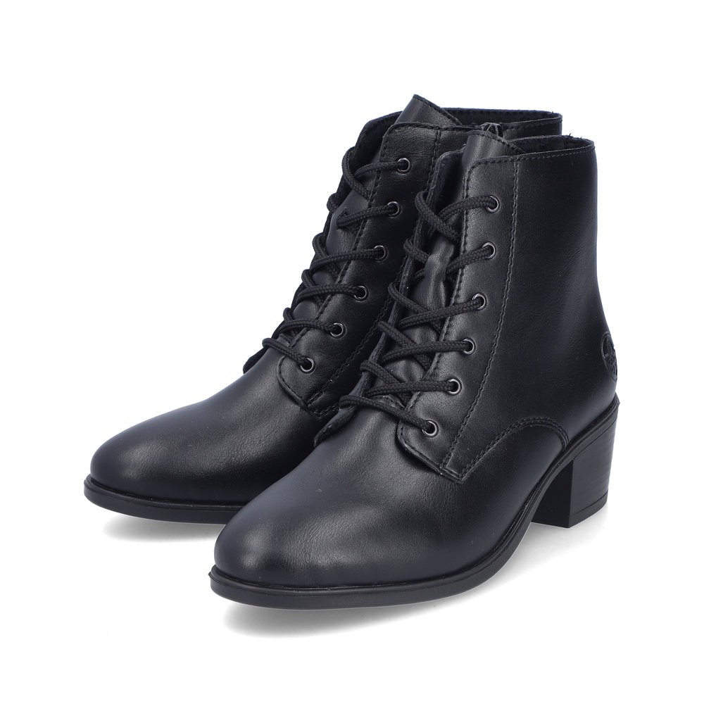 Midnight black Rieker women´s ankle boots 73930-00 with a zipper. Shoes laterally.