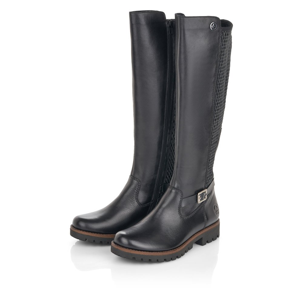 Black Rieker women´s high boots 78592-00 with a decorative buckle as well as zipper. Shoes laterally.