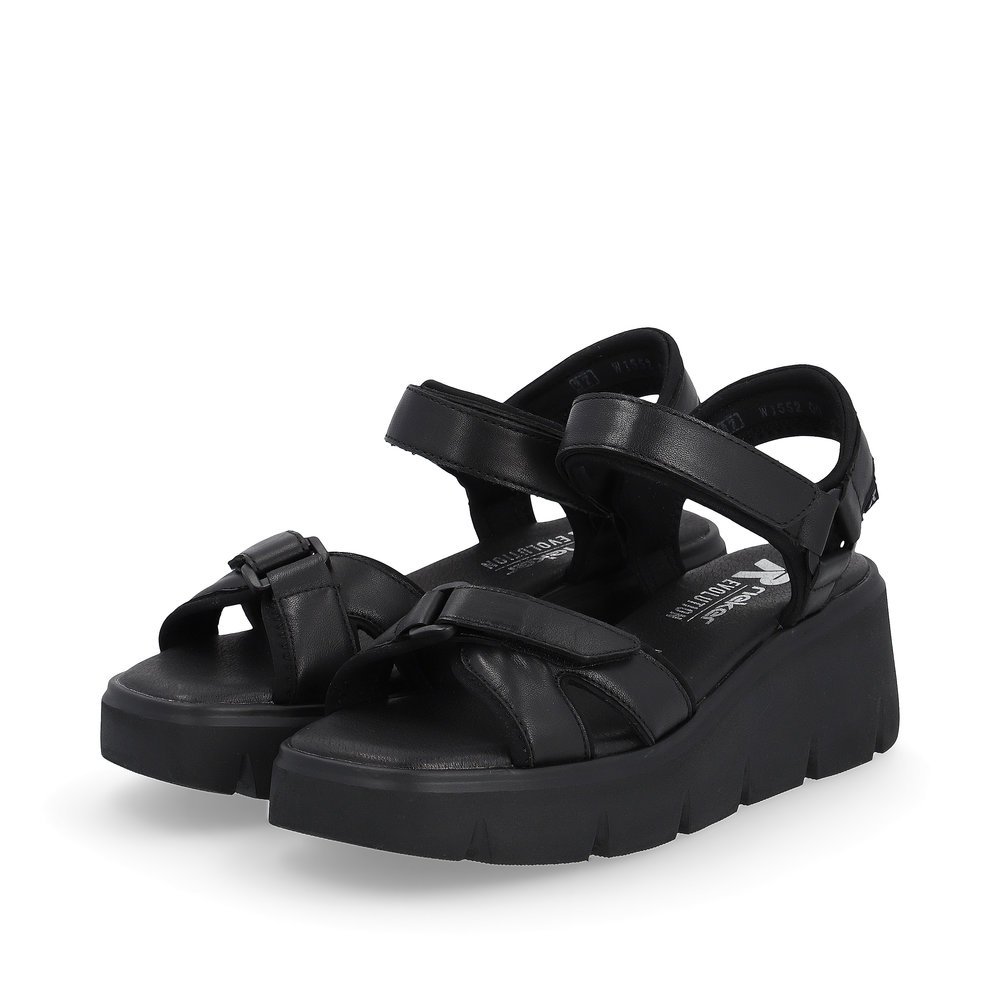 Black Rieker women´s wedge sandals W1552-00 with a flexible sole with wedge heel. Shoes laterally.