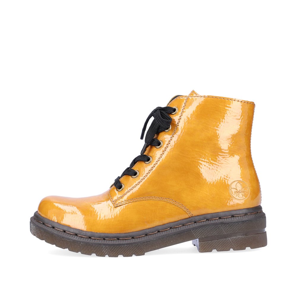 Glossy yellow Rieker women´s lace-up boots 78240-68 with a zipper. Outside of the shoe.