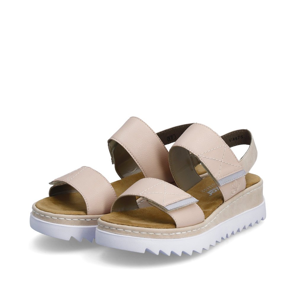 Pale pink Rieker women´s strap sandals V4475-31 with a hook and loop fastener. Shoes laterally.
