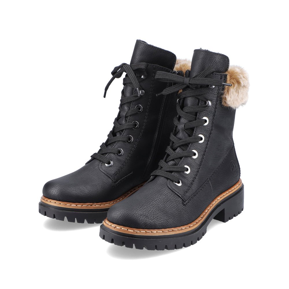 Black Rieker women´s lace-up boots 72630-00 with fur shaft collar as well as zipper. Shoes laterally.