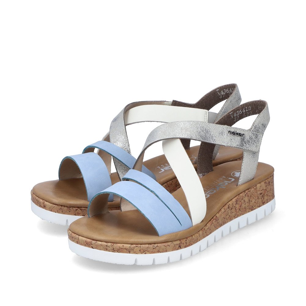 Pastel blue Rieker women´s wedge sandals V4364-10 with a hook and loop fastener. Shoes laterally.